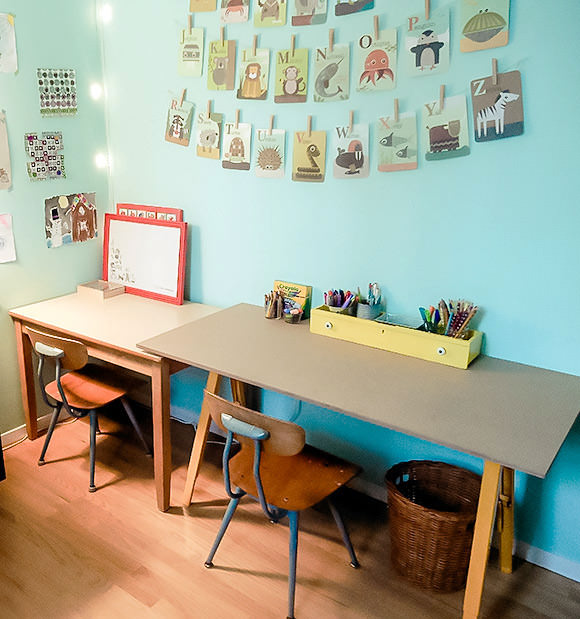 One of our fabulous readers recently shared this lovely craft studio she put together for her two boys using her own version of our DIY kid's craft desk - we're drooling over those fantastic little chairs!