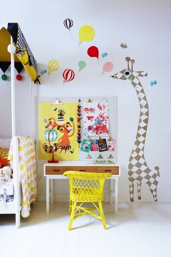 minimal kids room with bright pop of color via yellow painted rattan child's chair