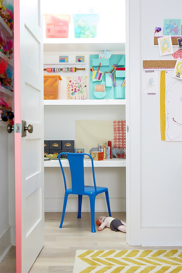 a hidden closet "office" in a kid's room, stocked with craft supplies