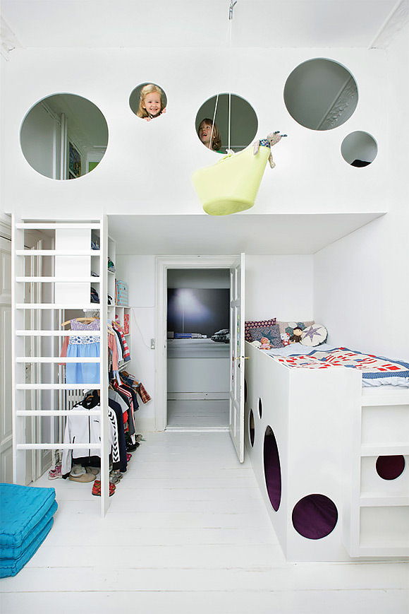 A suspended bunk bed in a kid's room cleverly designed for a small space