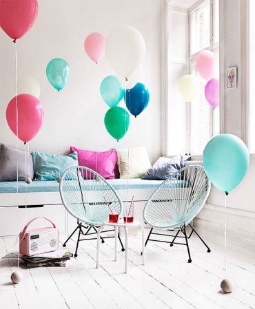 adding pops of color to a kid's room using balloons