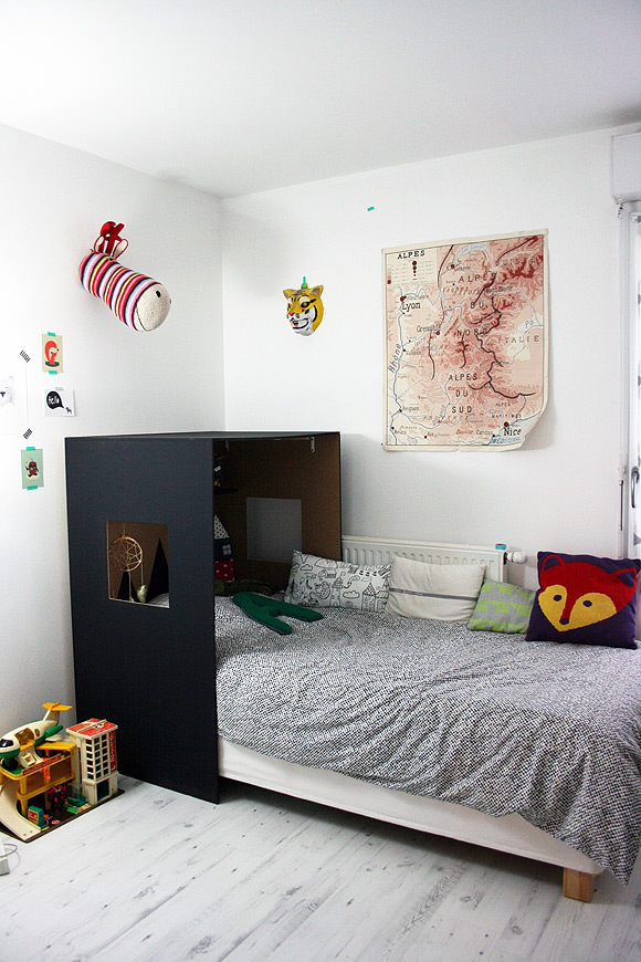 Simple custom headboard hideaway nook in a kid's room