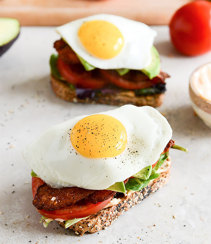 Breakfast Sandwich Recipe: Avocado BLT with Spicy Mayo and Fried Eggs (via How Sweet It Is)