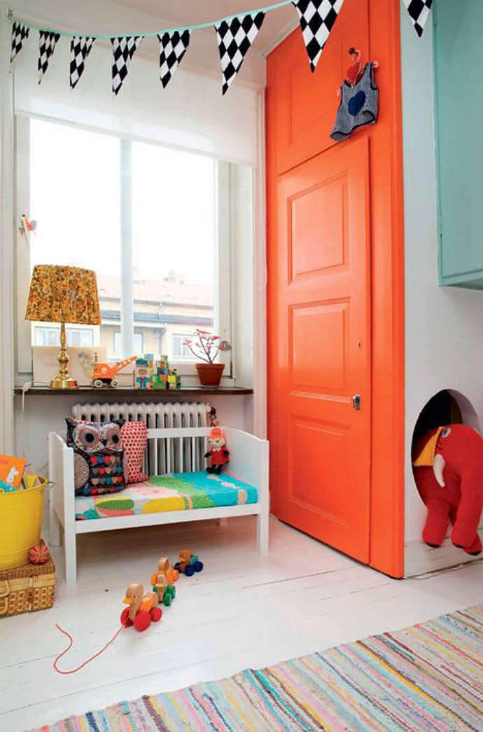 Love this orange door in a colorful Swedish family’s home